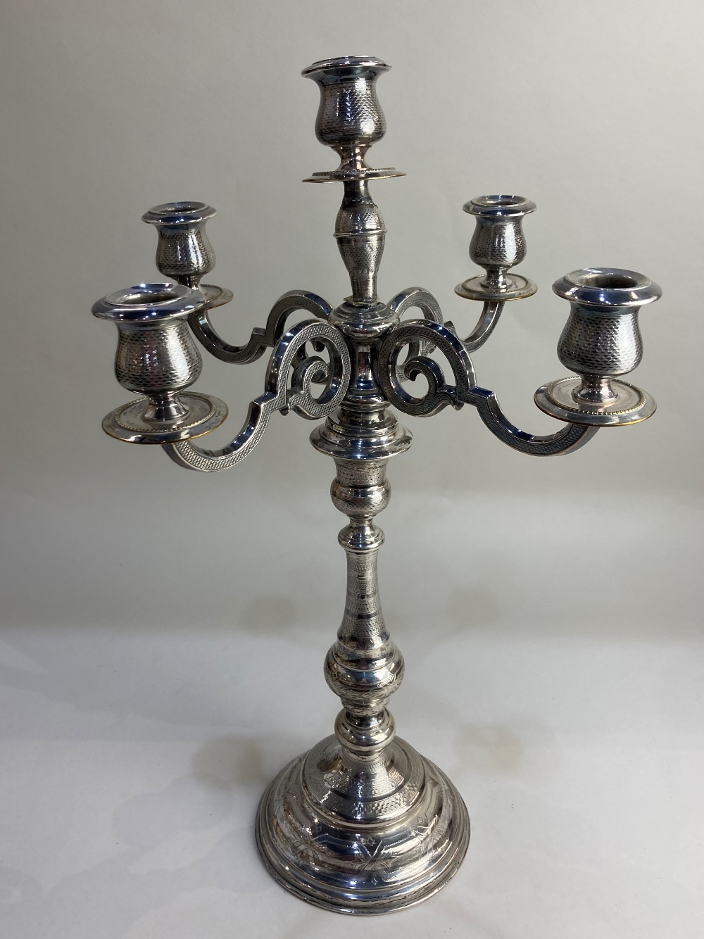 A silver plated five light candelabrum on baluster stem and circular base, (a/f)