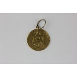 A gold coin pendant