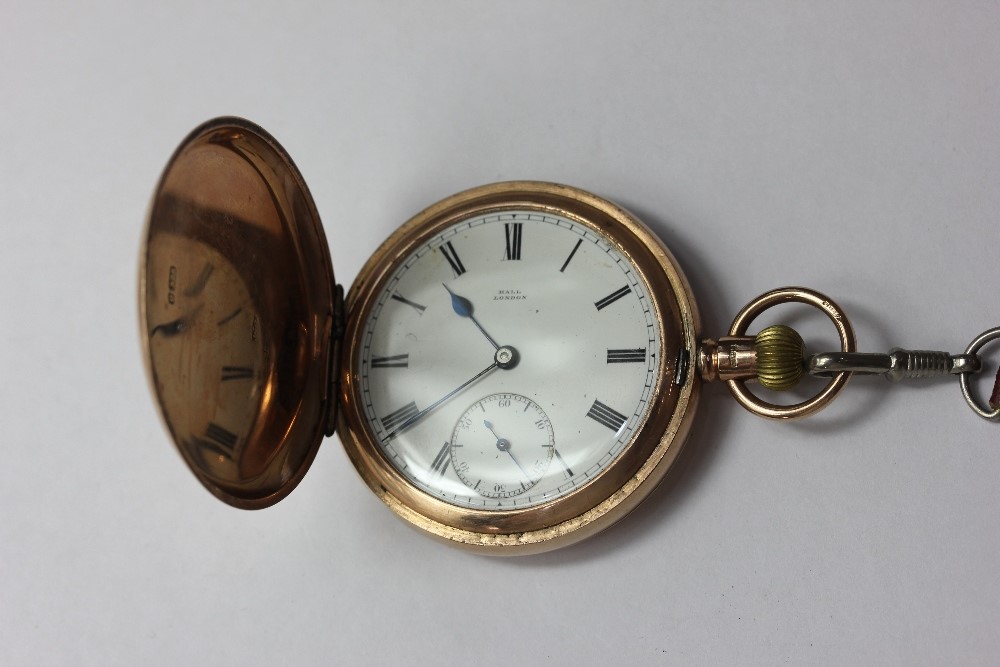 A 9ct gold hunter cased pocket watch the dial signed Hall London, on brown leather strap