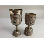An Indian white metal goblet with green cabochon and engraved design, mark to foot, together with an