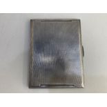 A George VI silver cigarette case, maker Smith & Bartlam, Birmingham 1945, with engine turned