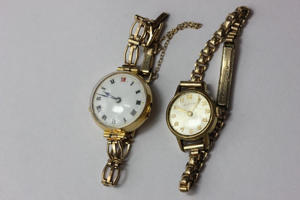 A lady's 18ct gold wrist watch on a 9ct gold bracelet, and a rolled gold watch