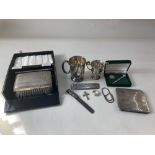 An Elizabeth II cased silver backed clothes brush and comb, maker W I Broadway & Co, Birmingham