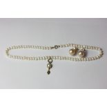 A freshwater pearl necklace with 9ct gold clasp; a pair of imitation pearl ear clips