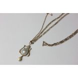 A baroque pearl pendant on neck chain