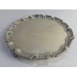 A George V silver salver, maker William Hutton & Sons, Sheffield 1924, with piecrust border, on