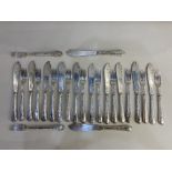 A Victorian set of twelve pairs of silver fish knives and forks with engraved blades and beaded