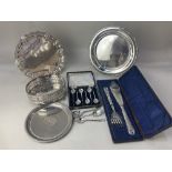 A collection of silver plated wares, including a salver, a cased pair of fish servers, a cased set