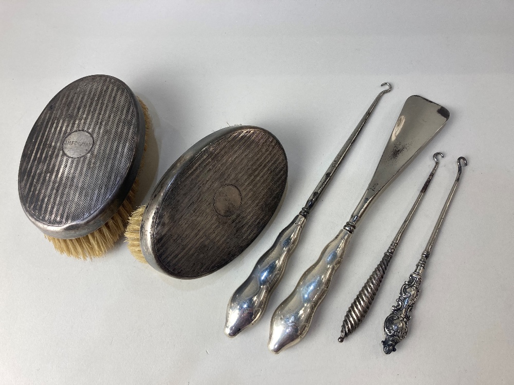 A pair of George V silver backed clothes brushes, maker Levi & Salaman, Birmingham 1925, (a/f