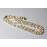 A two row cultured pearl necklace on a 9ct white gold and diamond clasp; a pair of imitation pearl