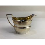 A George III silver cream jug, maker probably Abstinando King, London 1804, with gilt interior, 4.