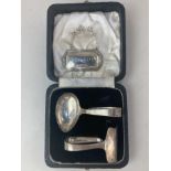 An Elizabeth II cased silver christening set of spoon and pusher, makers Viner's of Sheffield