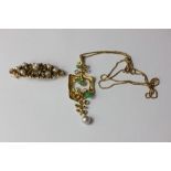 A pearl brooch in pierced gold mount with safety clip; another set with two green hardstone