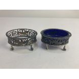 A pair of Edward VII silver salts, makers mark worn, London 1902, of pierced oval form, depicting