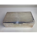 An American sterling silver large cigarette box, makers Tiffany & Co, presented to 'A. G. Sleep from