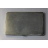 A George V silver cigarette case, maker Wilson & Gill, Birmingham 1933, with engine turned