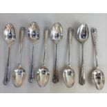 A set of eight Victorian silver coffee spoons with cast foliate handles, maker James Deakin and