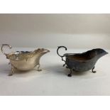 A pair of Edward VII silver sauce boats, maker Martin, Hall & Co, Sheffield 1909, with scalloped