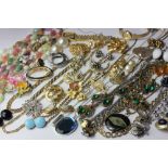 A collection of costume jewellery gilt metal necklaces, starburst paste brooch, two lady's