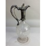 A Victorian silver plate mounted etched glass claret jug, with lion finial and grapevine design, the