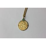 An Edward VII gold half sovereign dated 1902 in gem set gold clasp mount with 9ct gold chain