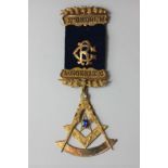 A 15ct gold Masonic jewel set with two gems; unmarked stick pin on bar engraved Lodge 82980; blue
