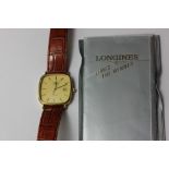 A Longines steel and gold plated gentleman's wrist watch, with paperwork