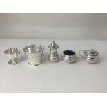 A George V silver three piece cruet set, maker S Blanckensee & Son Ltd, Birmingham 1932, monogrammed