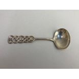 A Norwegian 830 silver spoon, maker David Andersen, the handle of pierced knotted form, 12cm long