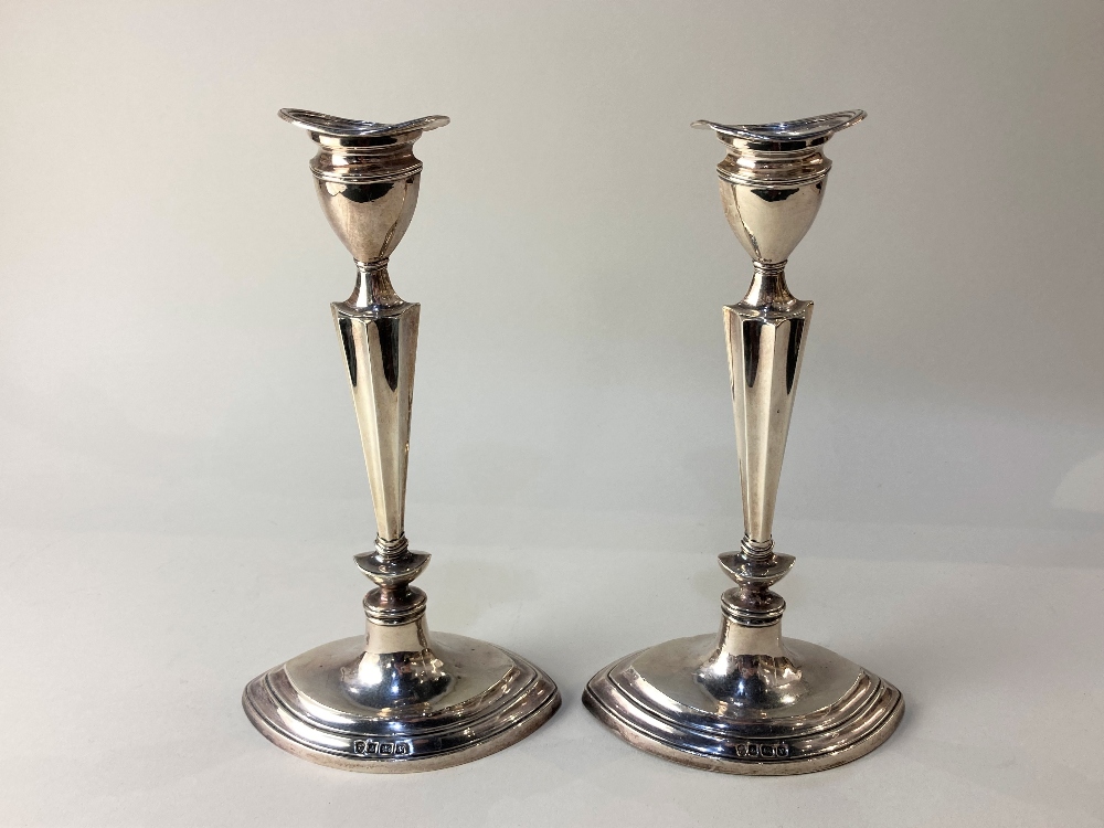 A pair of George V silver candlesticks, maker Williams Ltd, Birmingham 1920, of oval form with