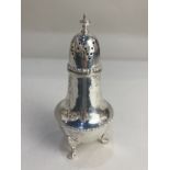 A George V silver sugar caster, makers Barker Brothers, Chester 1913, of pot bellied form, 16cm high