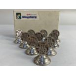 A set of ten Chinese sterling silver place holders, maker Kingsburg, Hong Kong, each decorated