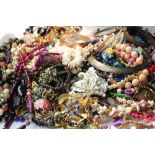 A quantity of costume jewellery to include a rolled gold bangle and a 22ct gold plated ingot