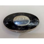 A silver mounted tortoiseshell trinket box, of oval form, with central cartouche engraved T P