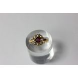 A tourmaline and pearl cluster ring in 18ct gold