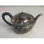 A Victorian silver bachelors teapot, maker Josiah Williams & Co, London 1897, with embossed acanthus