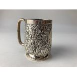 A Victorian silver christening mug, maker E S Barnsley & Co, Birmingham 1889, with embossed