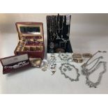 A quantity of costume jewellery to include some silver jewellery and a silver ingot pendant