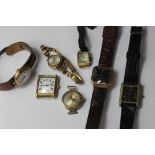 An 18ct gold Delux wrist watch and four other wrist watches in steel, 9ct gold and silver cases