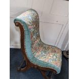 A Victorian nursing chair, with scroll end frame and button back tapestry style upholstery (a/f)