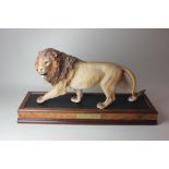 Two large Franklin Mint models of a lion and a tiger, 'On the Prowl' and 'Monarch of the Serengeti',