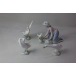 Three Lladro porcelain models of white geese in various poses, tallest 13cm, together with a Nao