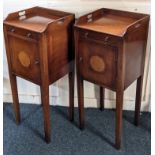 A pair of reproduction mahogany bedside or pot cupboards, with three-quarter galleried tray top