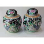 A pair of Chinese porcelain ginger jars and covers, decorated with birds amongst blossom and