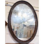 A Wylie & Lochhead Ltd Glasgow oval mahogany framed wall mirror, mirror plate 73cm by 48cm