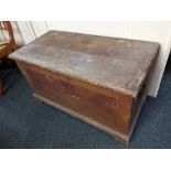 A 19th century stained pine trunk, the rectangular hinged top enclosing a candle box, on bracket