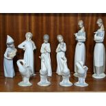 Four Lladro porcelain models of white geese, tallest 12cm high, together with a Lladro figure of a