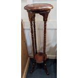 A modern mahogany jardiniere stand, with circular top and under shelf, on spiral twist supports to