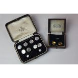 A cased set of 15ct gold mother of pearl dress studs and cufflinks in blue leather fitted box, and