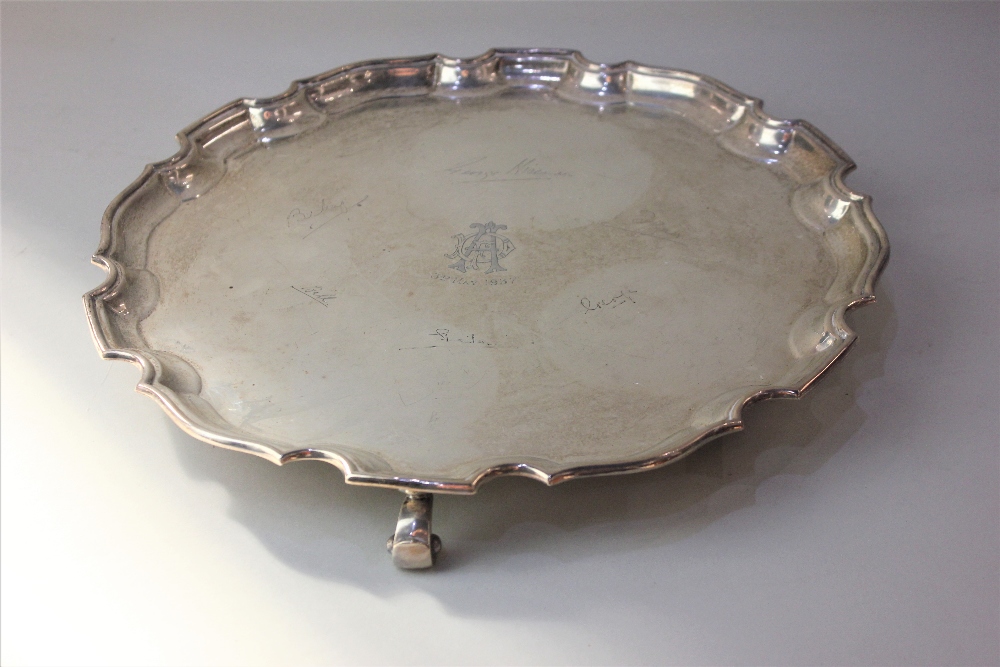 An Edward VIII silver salver with pie crust border, engraved monogram and presentation signatures,